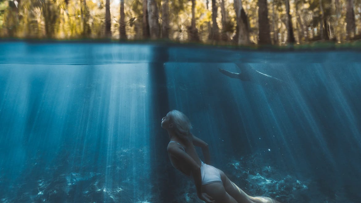 Girl swimming in Bitter Springs