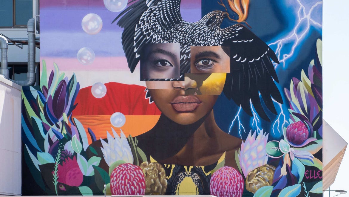 Art mural painted of a woman on the side of a building in Darwin City