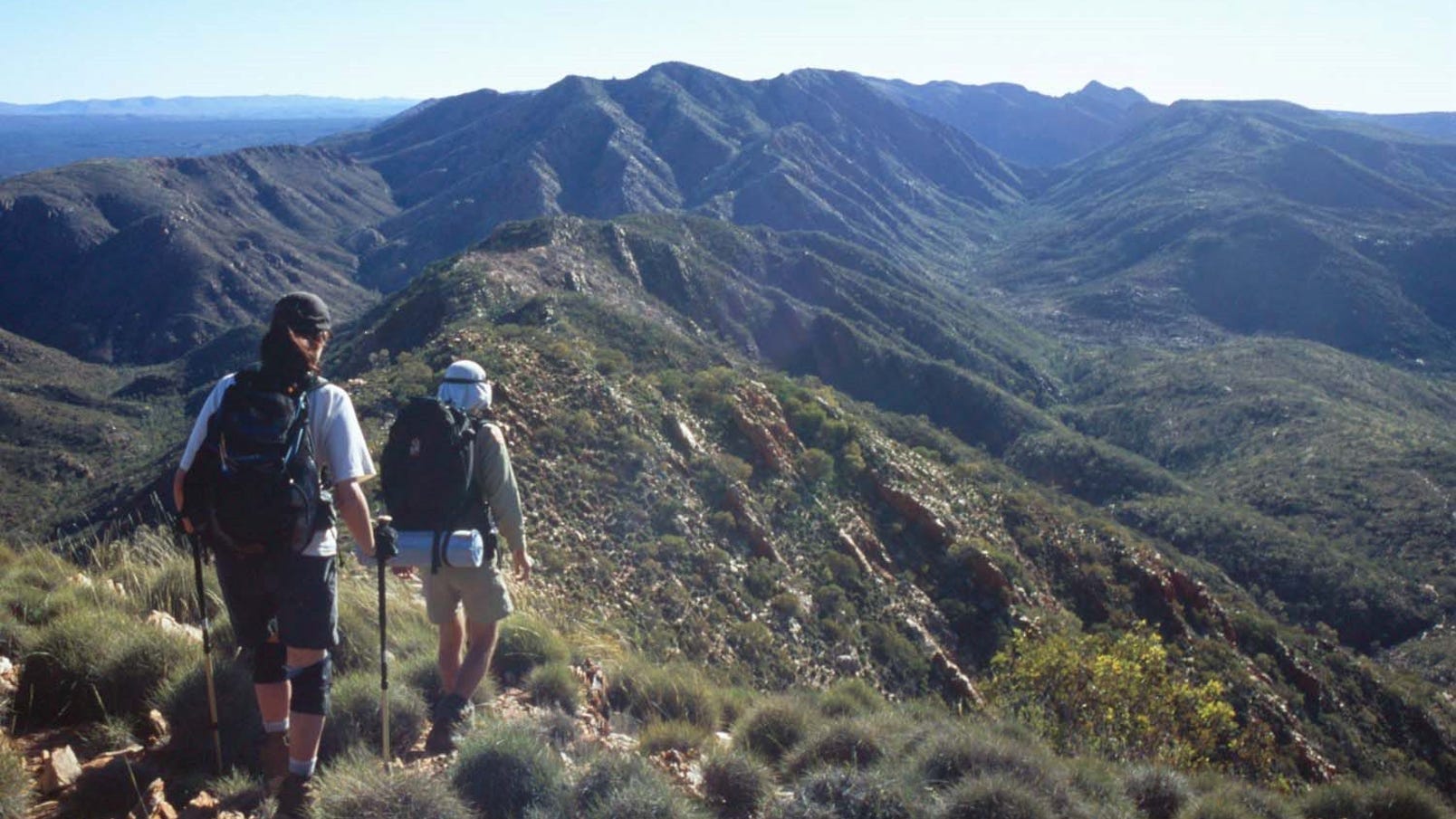 Two people hiking the larapinta trail in central australia