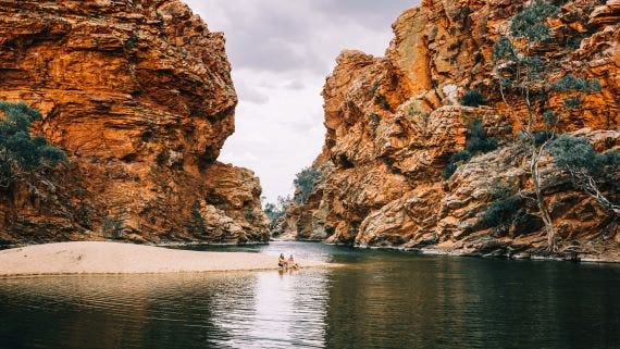 a couple sitting on the sand bank of ellery creek big hole.jpg