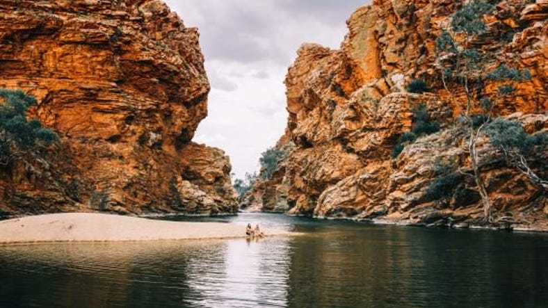 a couple sitting on the sand bank of ellery creek big hole.jpg