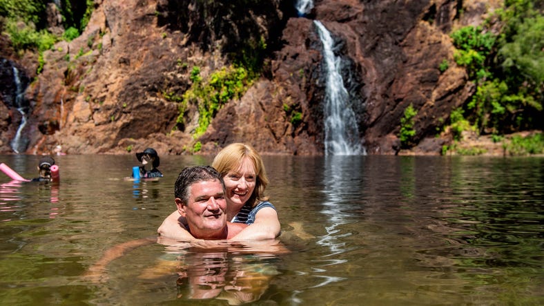 2-couple swimming at wangi falls litchfield national park,-d-,jpg
