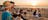 Couple enjoying food whilst watching the sun set at Mindil Beach Sunset Markets