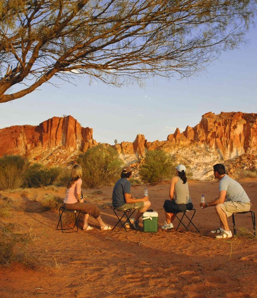 Group of friends sitting together near the Rainbow Valley in Alice Springs