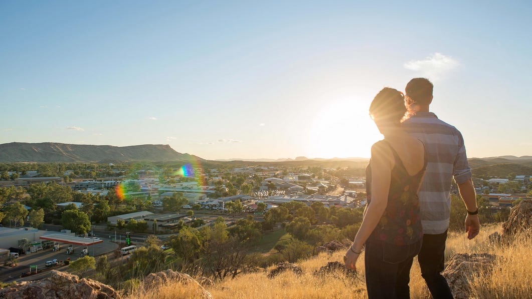couple enjoying the view of alice springs from anzac hill