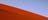 A red sand dune contrasting against the blue sky in the Simpson Desert