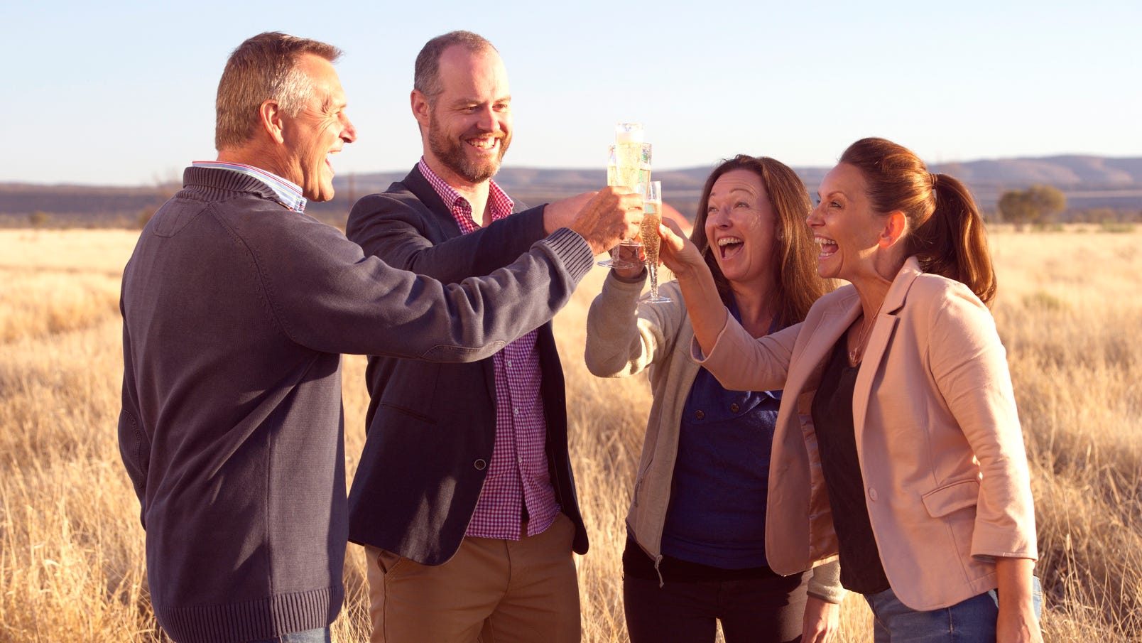 People-celebrate-hot-air-balloon-flight-sparkling-wine