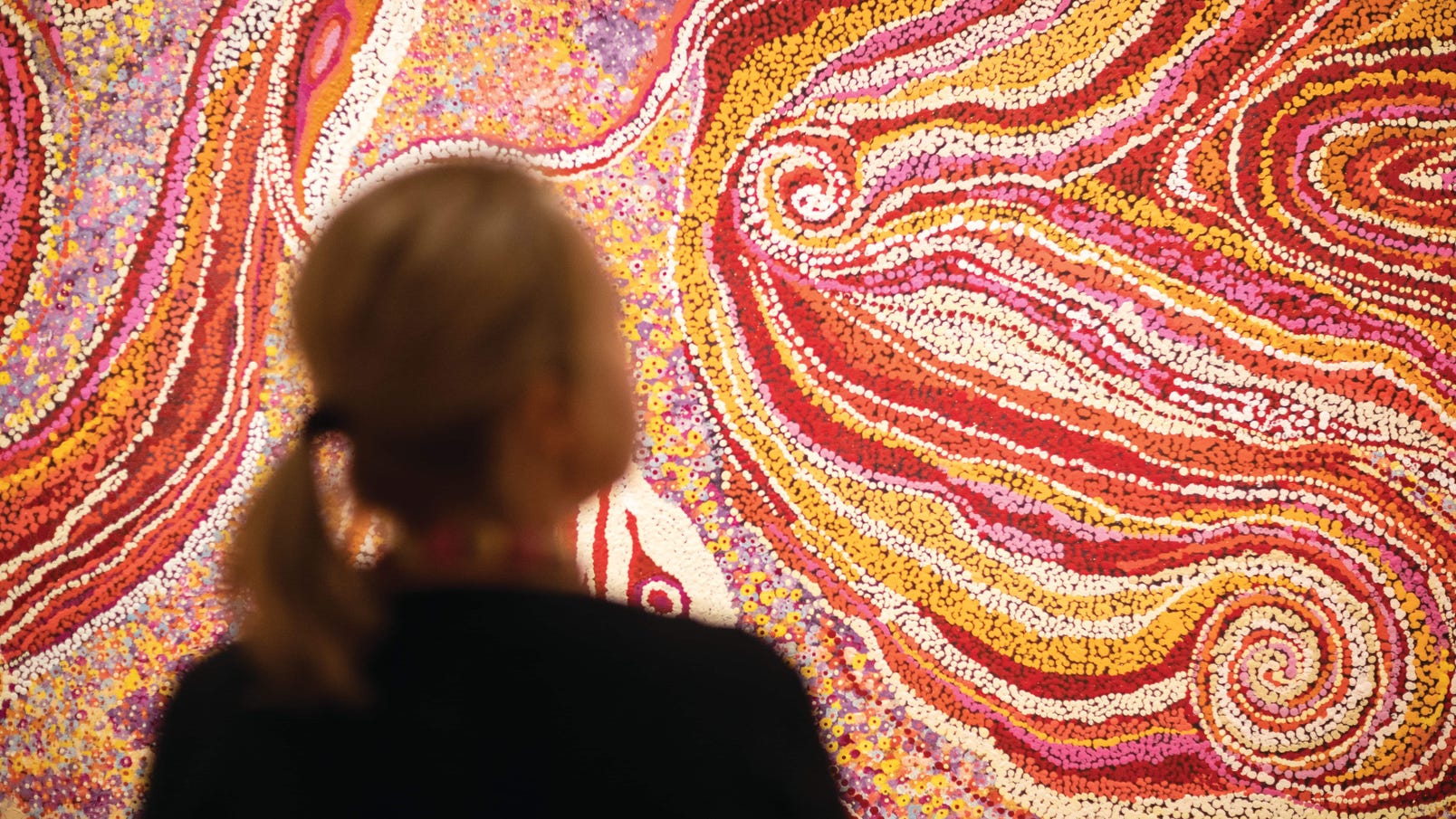 Woman looking at a painting at Araluen Arts Centre