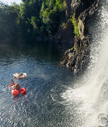 Friends swimming at Wangi Falls