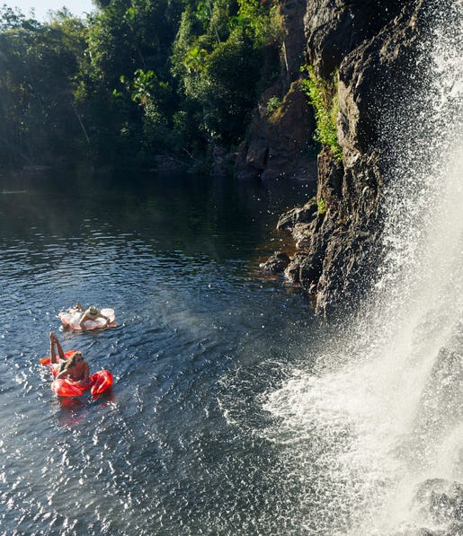 Friends swimming at Wangi Falls