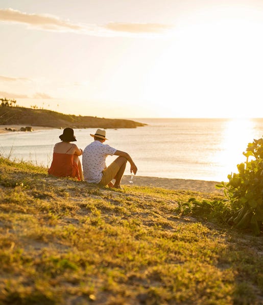 Couple enjoying a glass at sunset while on a Banu Banu Wilderness retreat in Arnhem Land
