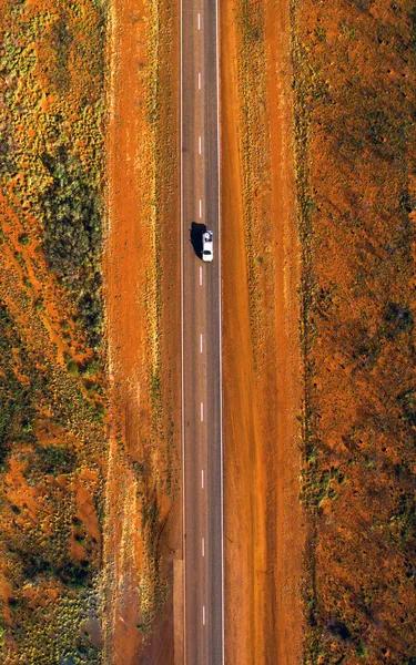 Aerial shot of vehicle travelling on the Stuart Highway, Alice Springs Region