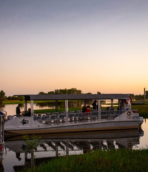 Yellow Water Cruises boat on the water at the wetlands during sunset