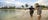 A visitor trying spear fishing at Bawaka beach Aboriginal experience in Arnhem Land