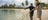 A visitor trying spear fishing at Bawaka beach Aboriginal experience in Arnhem Land