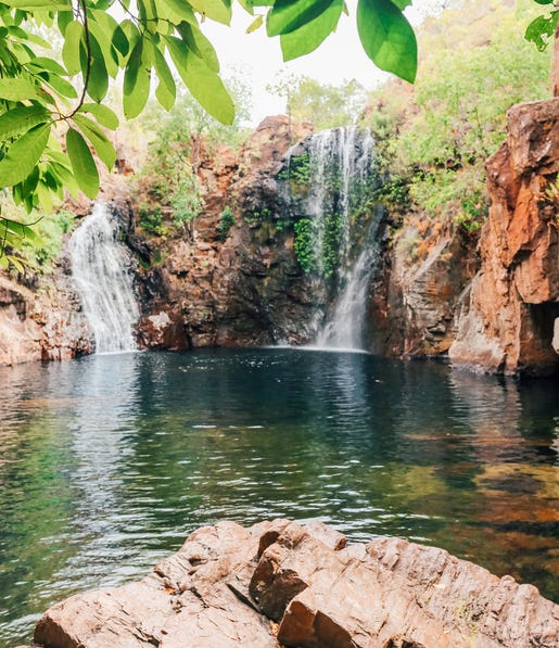 the rocks next to florence falls and the waterhole underneath them