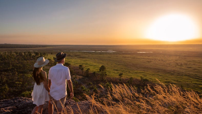 A couple watching the sun set over Kakadu