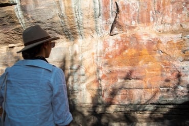 Girl checking out the rock art at Ubirr