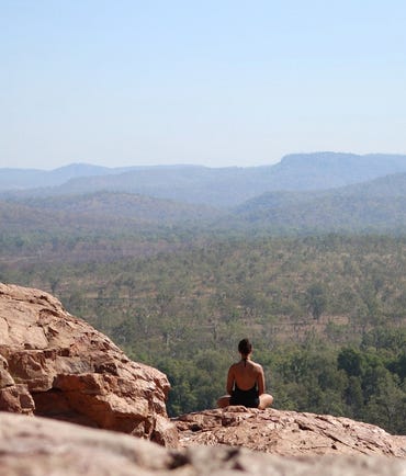 Morgan sitting on some rocks in kakadu
