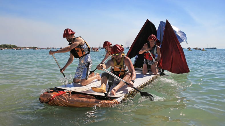 Four people racing at the Darwin Beer Can Regatta