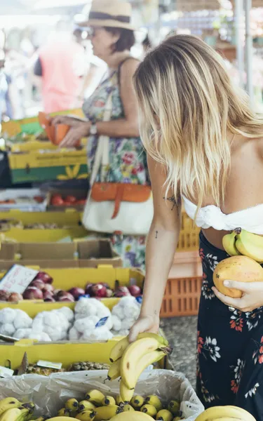 Woman looking at fruit at Parap Markets