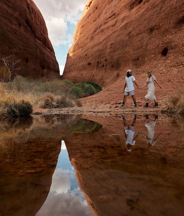 A couple holding hands while walking through Walpa Gorge