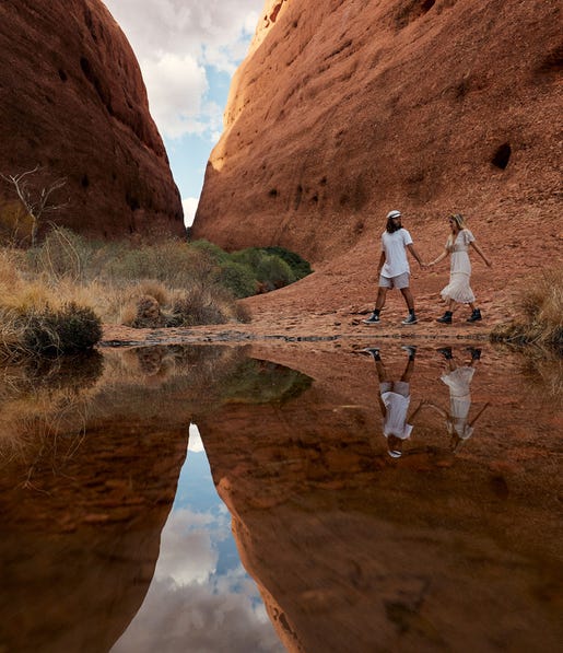 A couple holding hands while walking through Walpa Gorge