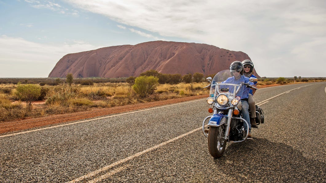 Harley davidson ride with Uluru in the background