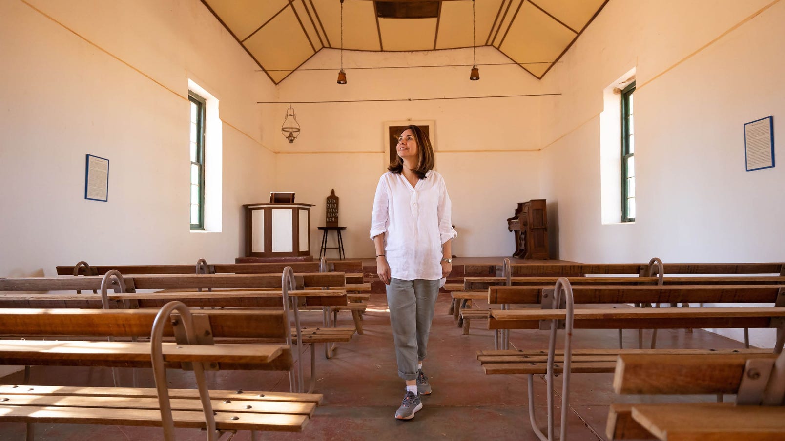 woman in historic church in hermannsburg in central australia