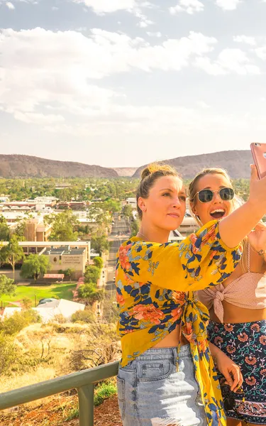 Two girlfriends taking a selfie at Anzac Hill in Alice Springs