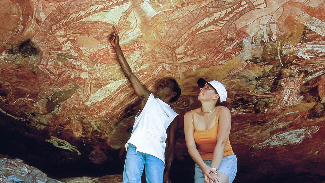 pointing out rock art in Kakadu