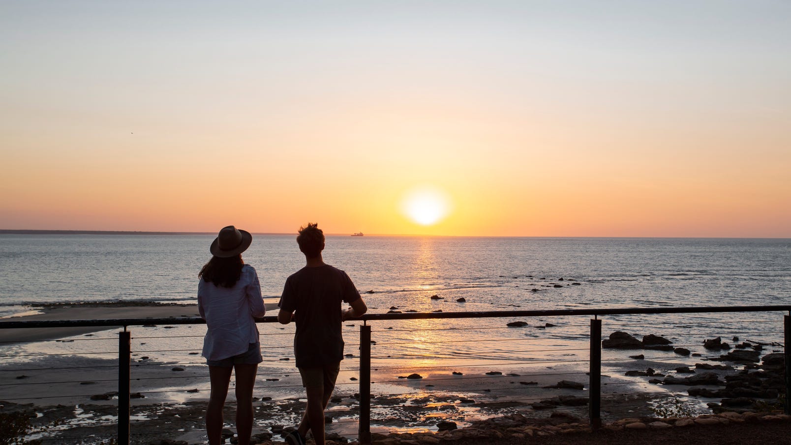 Couple watching sunset at East Point