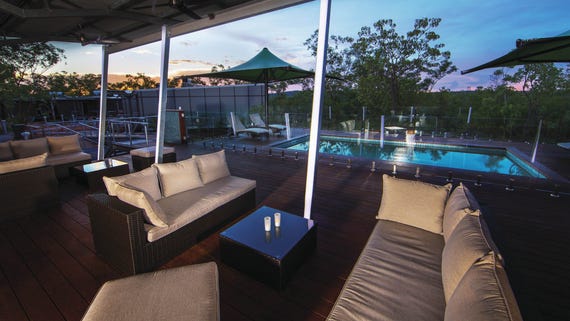 Lounge room and pool at the Cicada Lodge in Katherine