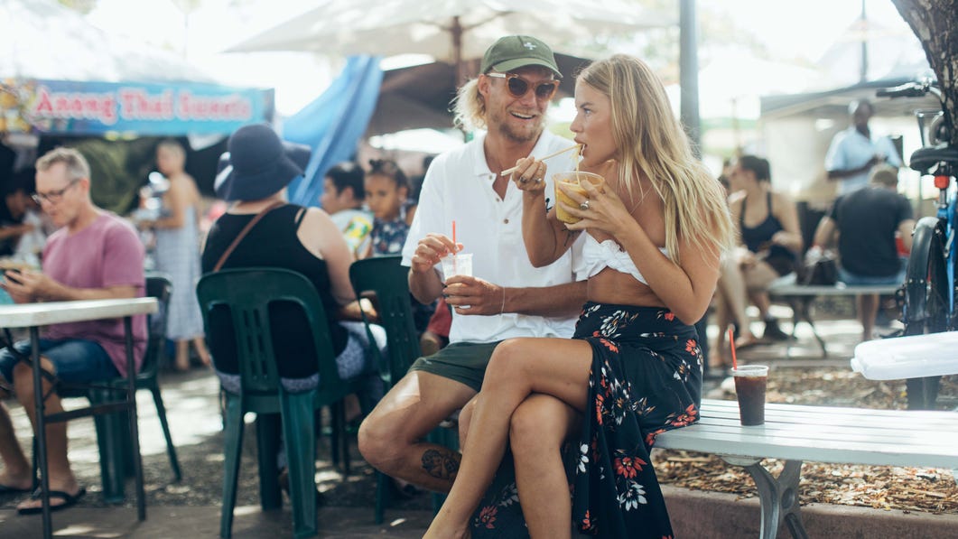 Friends enjoying food at the Parap markets