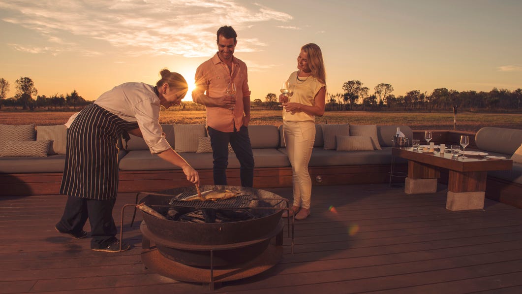 Cooking dinner outdoors at Wildman Wilderness Lodge