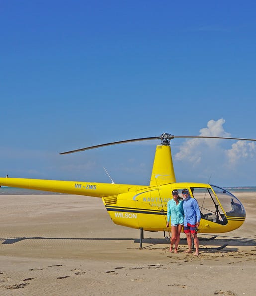 Couple-on-beach-doing-Heli-fishing-tour