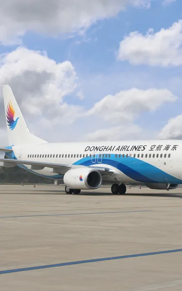 A Donghai Airlines plane on an airport tarmac
