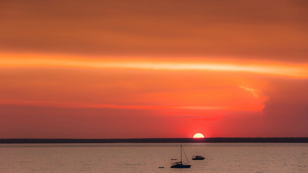 Yacht sailing past at Mindil Beach
