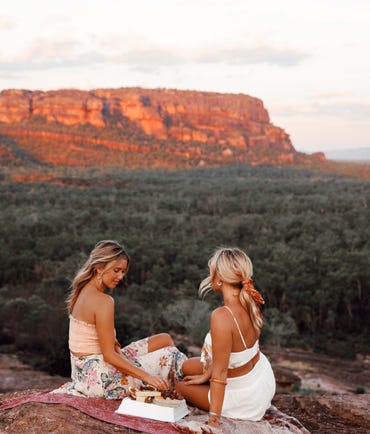 Friends enjoying nibbles at the top of Nourlangie rock