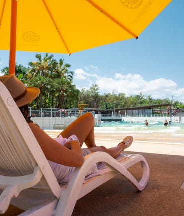 Woman on a sun lounge at the Darwin Waterfront