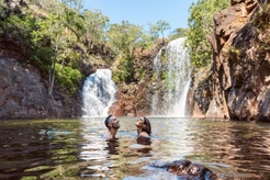 Couple swimming at Florence Falls in Litchfield
