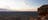 Man up on a rock escarpment looking over West MacDonnell Ranges