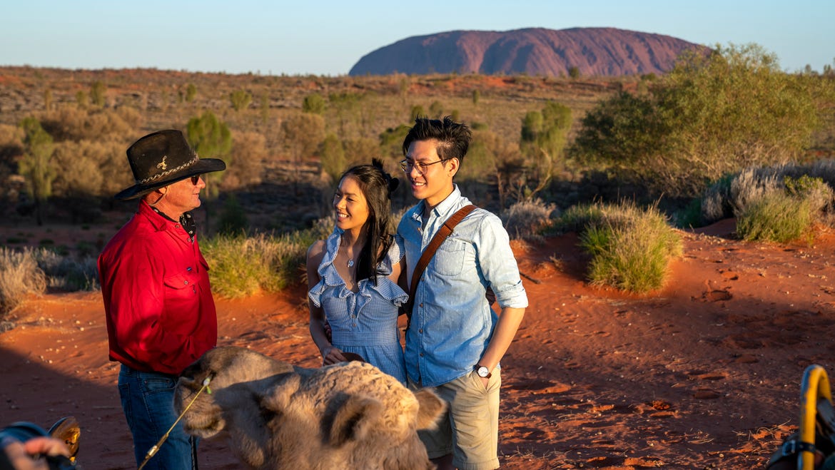 Couple-cuddling-camel-in-front-of-Uuru