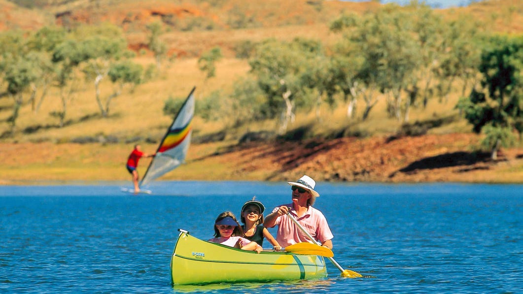 Family kayaking on Lake Maryann near Tennant Creek