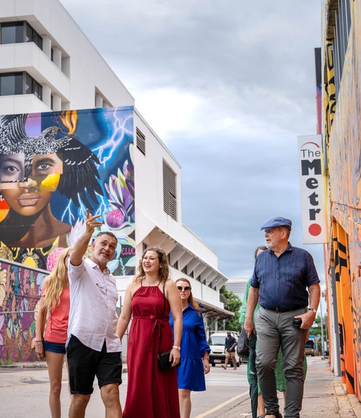 group walking through street art on the darwin gourmet food tour