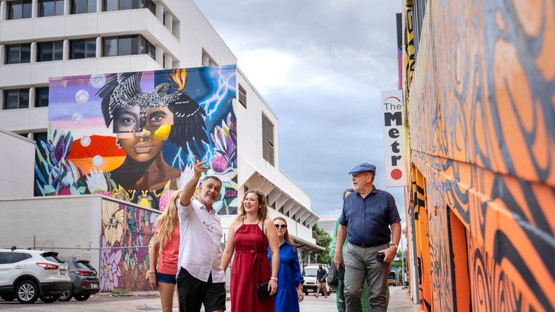 group walking through street art on the darwin gourmet food tour
