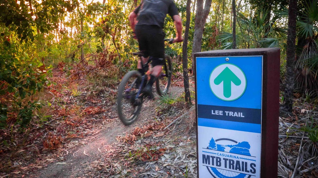 Person biking on a trail at Lee point in Darwin