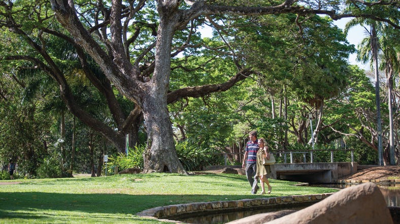 A couple walking in George Brown Darwin Botanic Gardens in Darwin