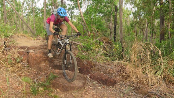a-woman-mountain-biking-on-a-trail-in-darwin,-d-,jpg