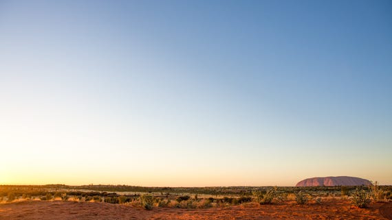 Landscape view of Uluru at sunrise